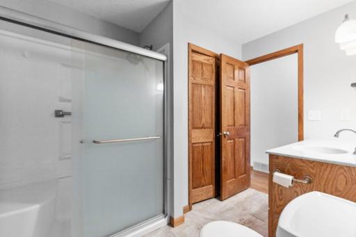 The upper-level bath was remodeled to add a 6-foot walk-in shower with a seat to accommodate the sellers physical needs. There are 3 bedrooms on the main level also.