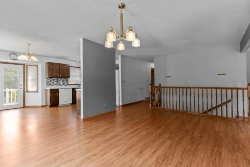 The entire main dining, kitchen, and hallway areas have easy-care laminate flooring.