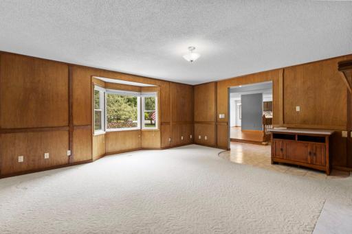Here is the view from the corner of the family room towards the formal dining room and kitchen. You will appreciate all the main-level space this home provides.
