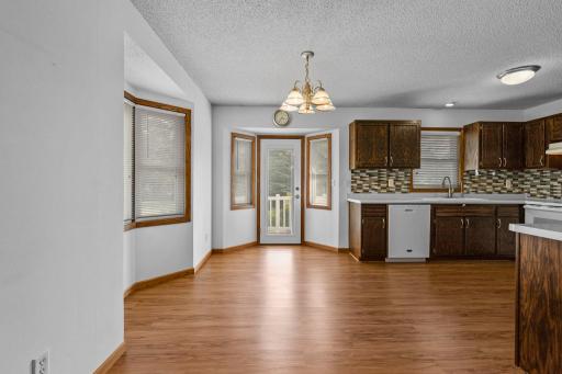 This is the eat-in dining area and a bayed window, plus a bayed terrace door to the patio.