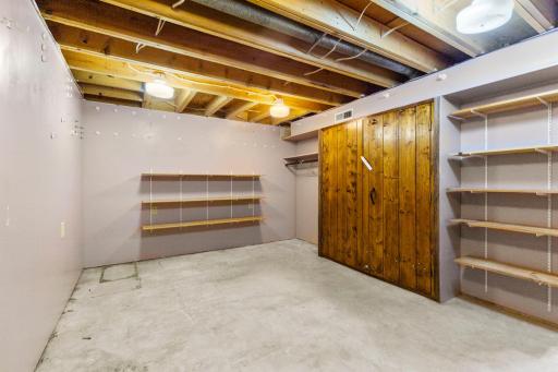 This is another storage and workspace in the lower level. The seller actually built this safe!