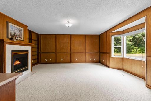 This is such a great room to gather the family. Look at the beautiful yard view from the bay window.