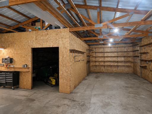 The pole barn has a separate area for storage.