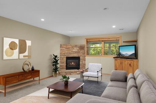 Virtually staged lower level family room.