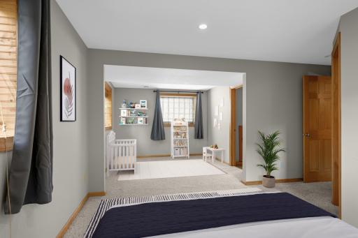 Virtually staged lower level bedroom with bonus space.