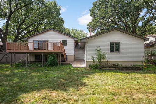 Deck conveniently has stairs down to concrete pad that connects to bonus garage.