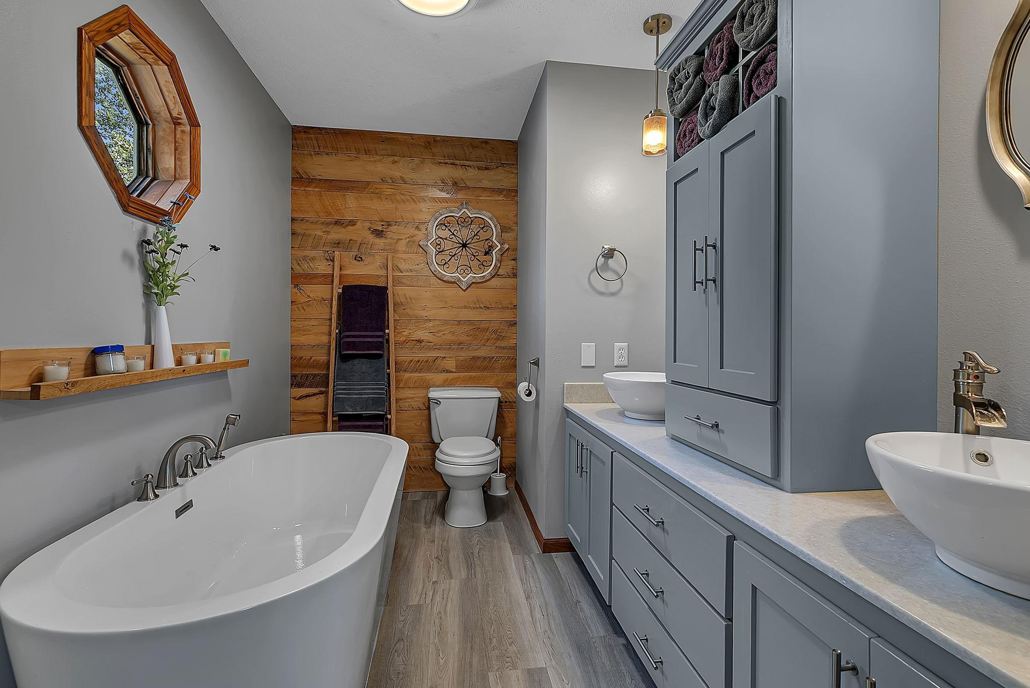 The private master bath features a large soaking tub...