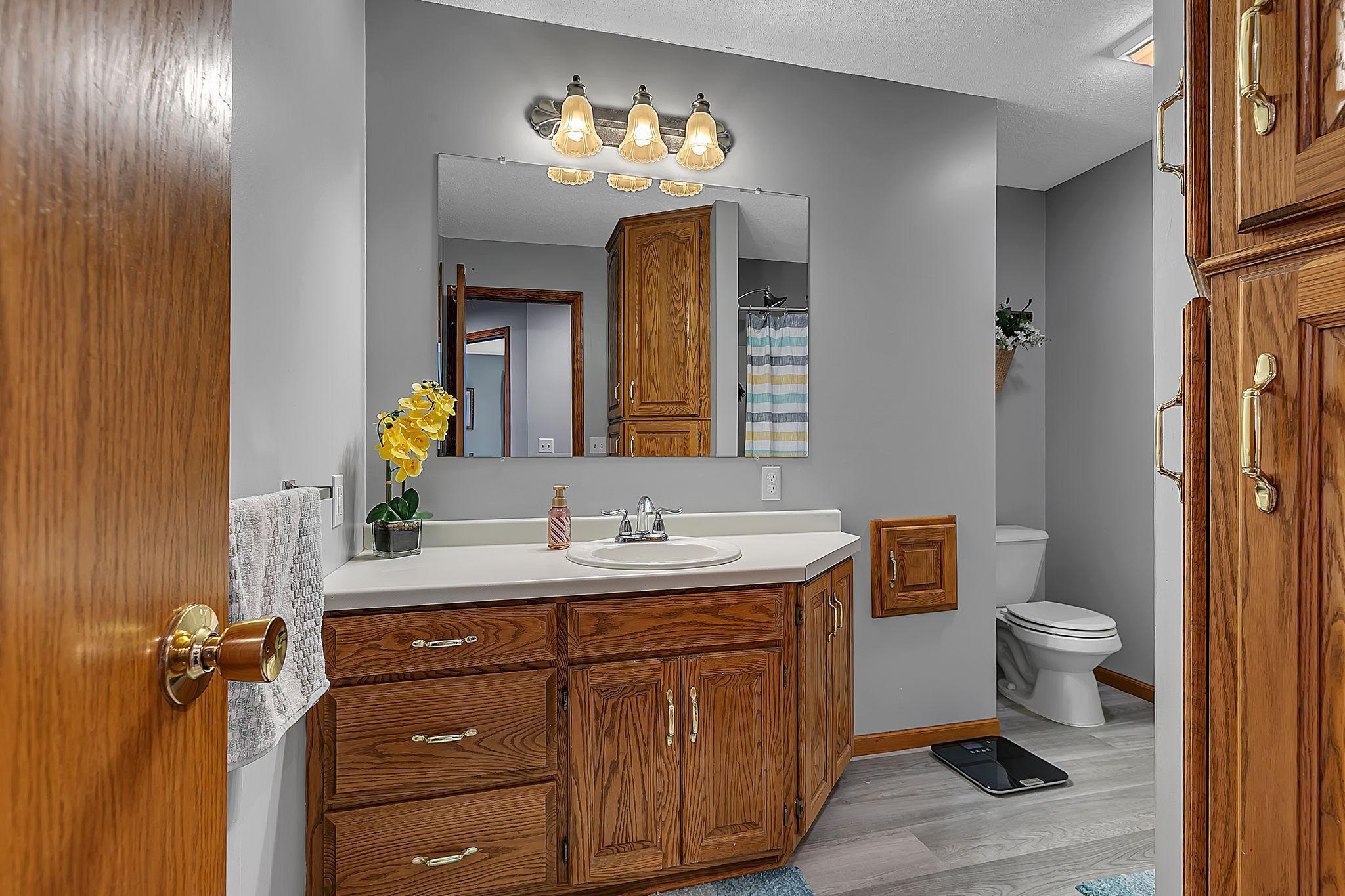 ANOTHER full bath in the upper level with a laundry shoot!