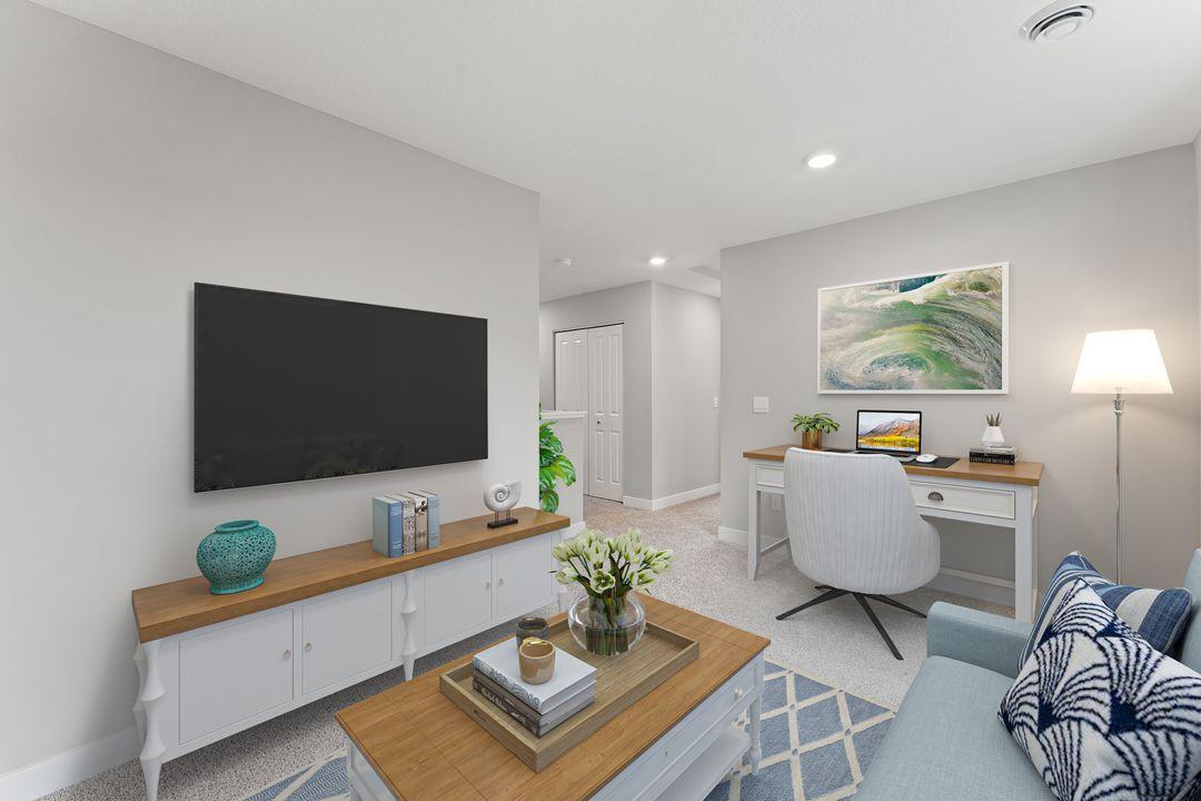 The upper level loft provides the perfect retreat or additional entertaining space. (Model photo, colors may vary)