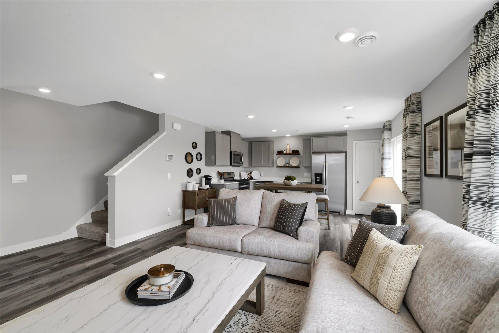 Welcome home to the Duet by D.R. Horton! Complete open concept main floor for all your entertaining needs! (Model photo, colors may vary)