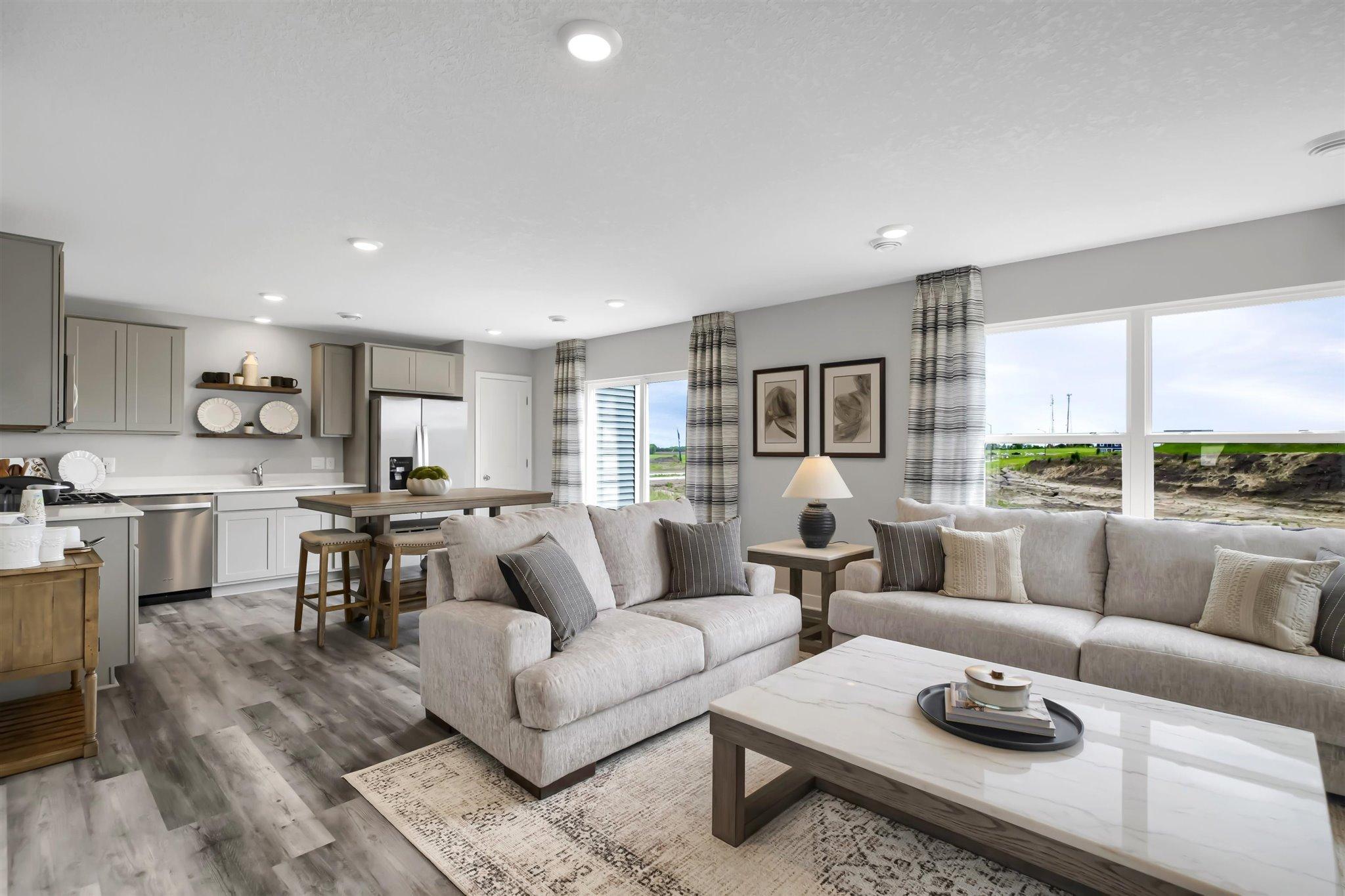 Enjoy the natural light in your truly open living space. (Model photo, colors may vary)
