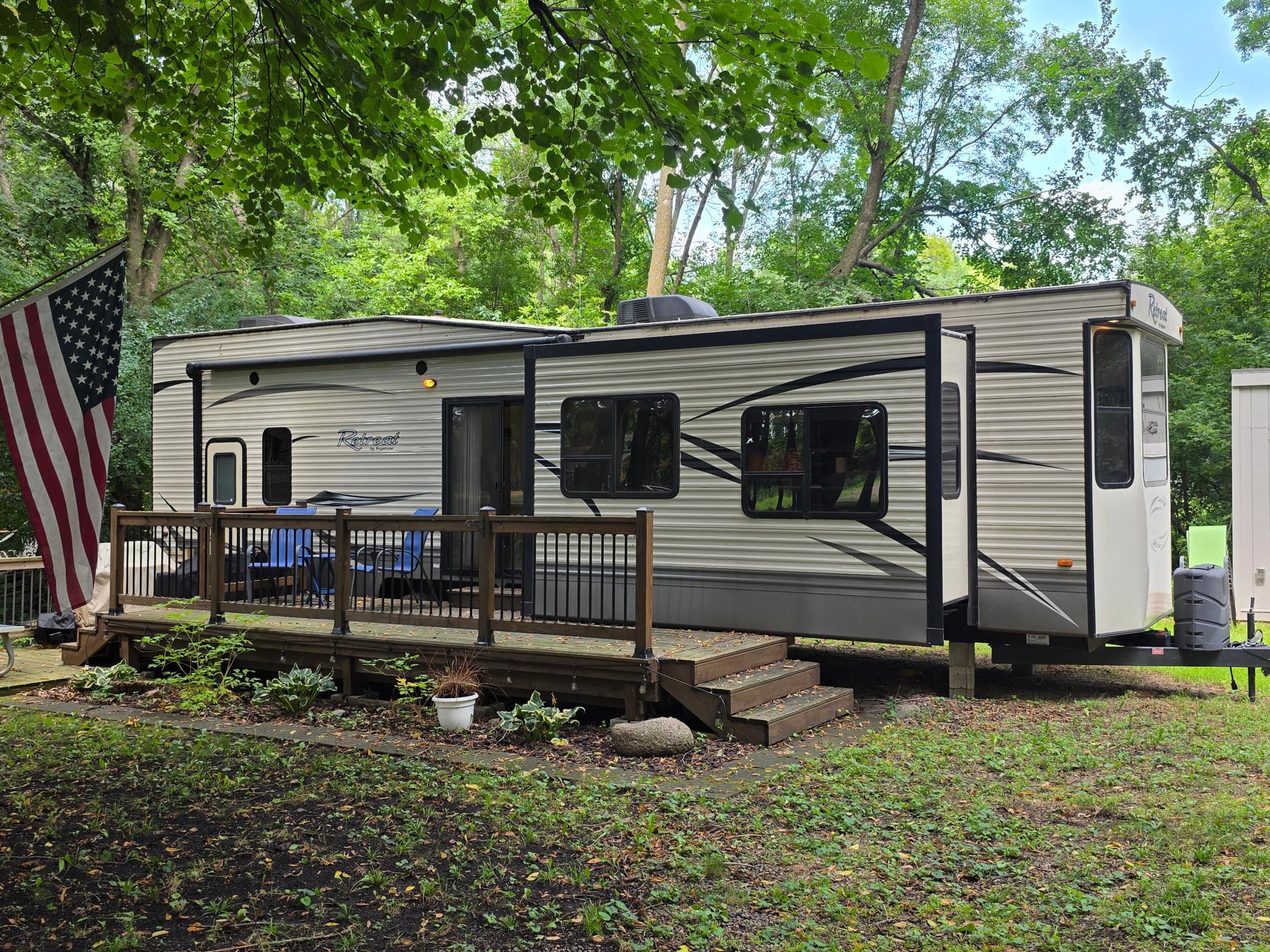 2016 Retreat by Keystone with deck, shed and one of the largest units in the RV Resort.