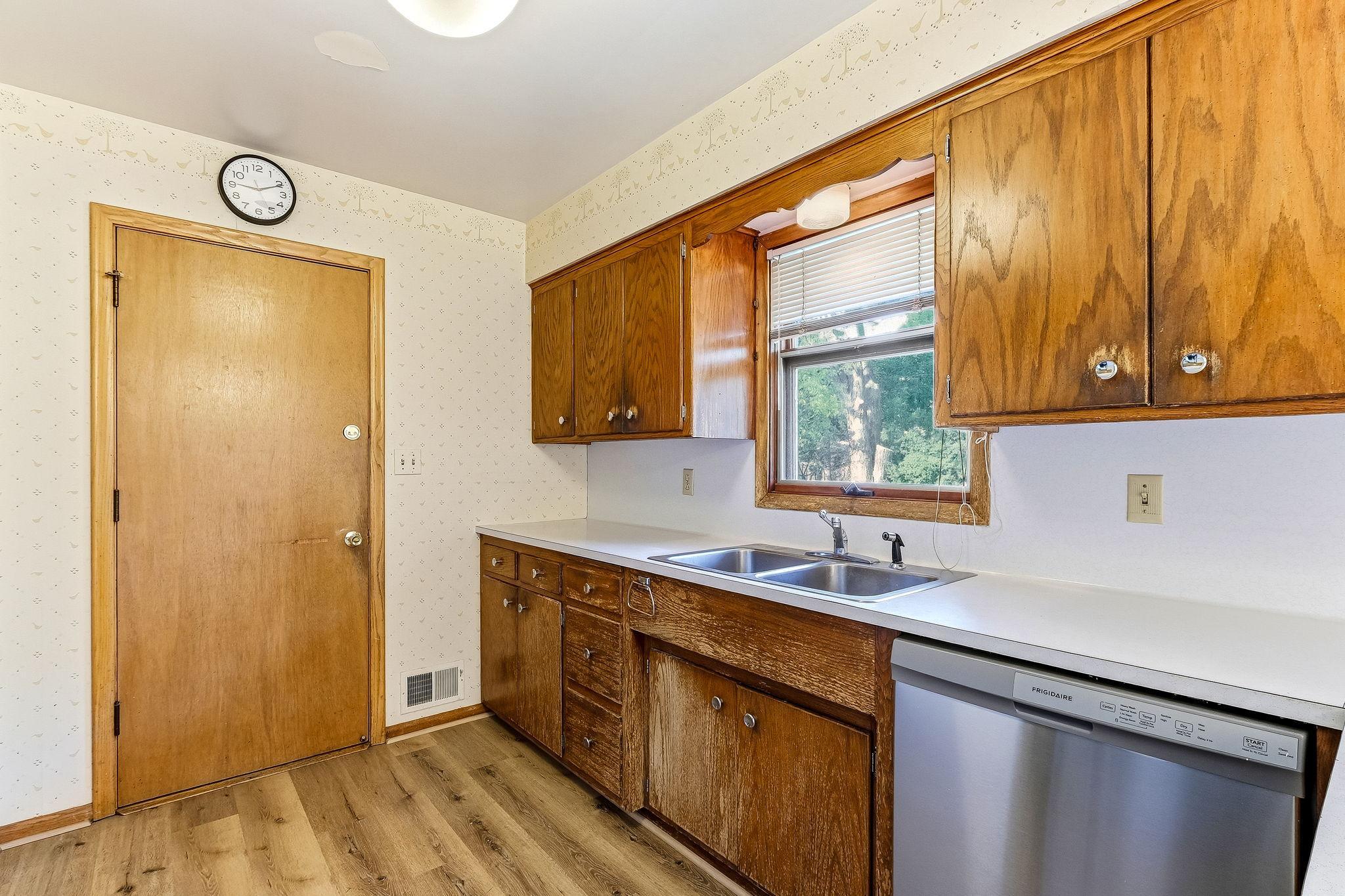 New stainless dishwasher in kitchen.