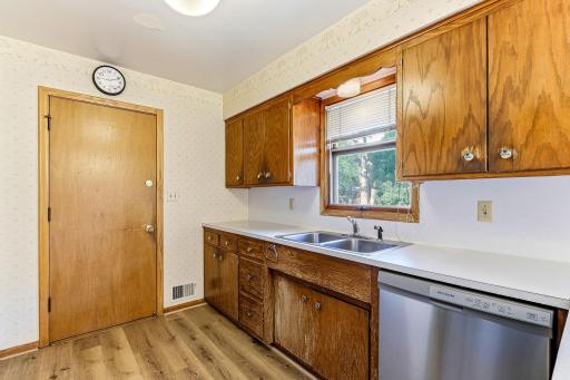 New stainless dishwasher in kitchen.