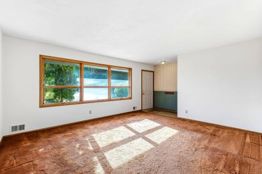 Large picture window looks out to front yard.