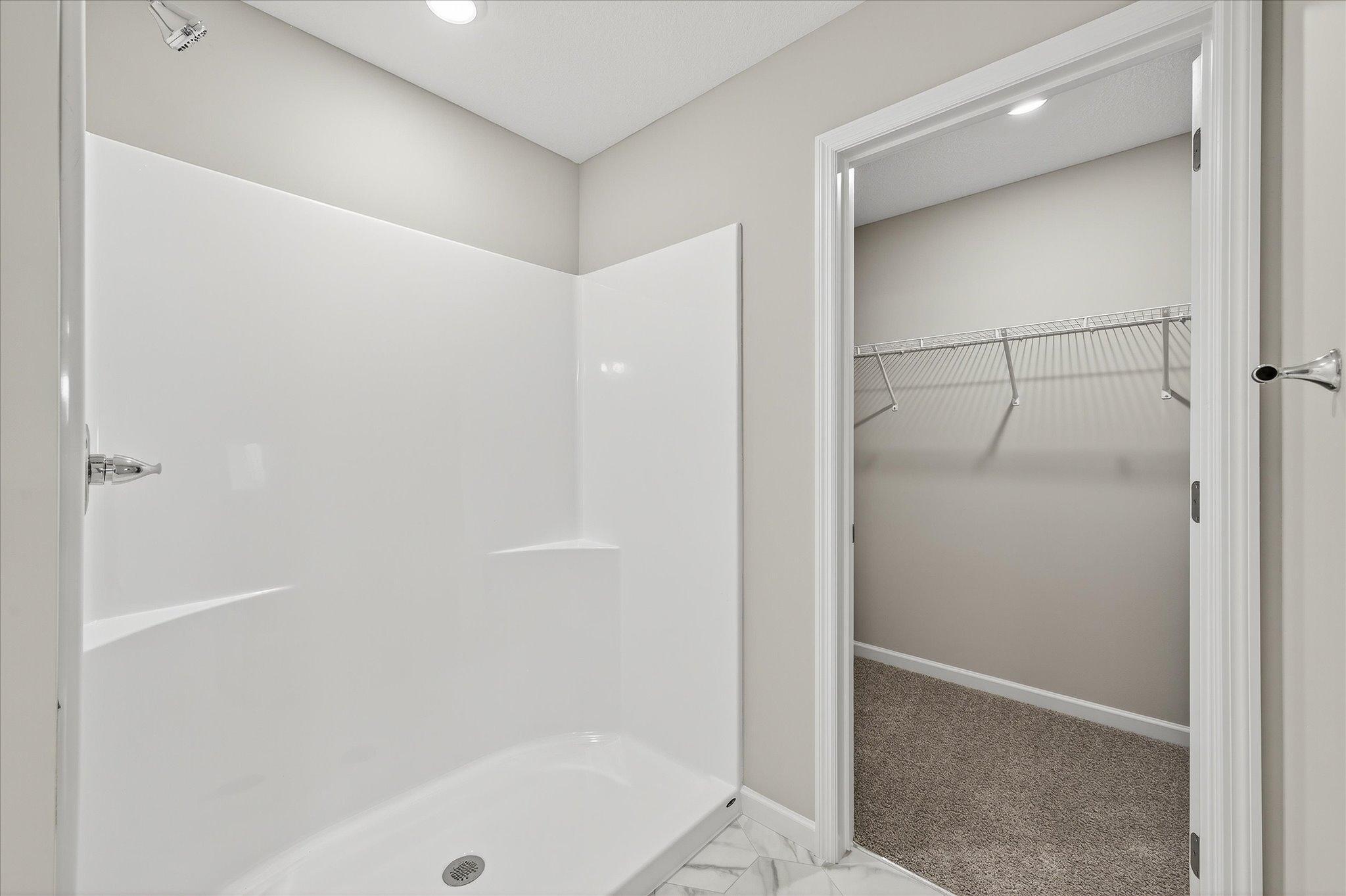 A thoughtfully designed primary bath gives you a dedicated space to get ready, reset, and unwind. The primary walk-in closet provides plenty of dedicated space to keep clothing, shoes, and everyday essentials organized.
