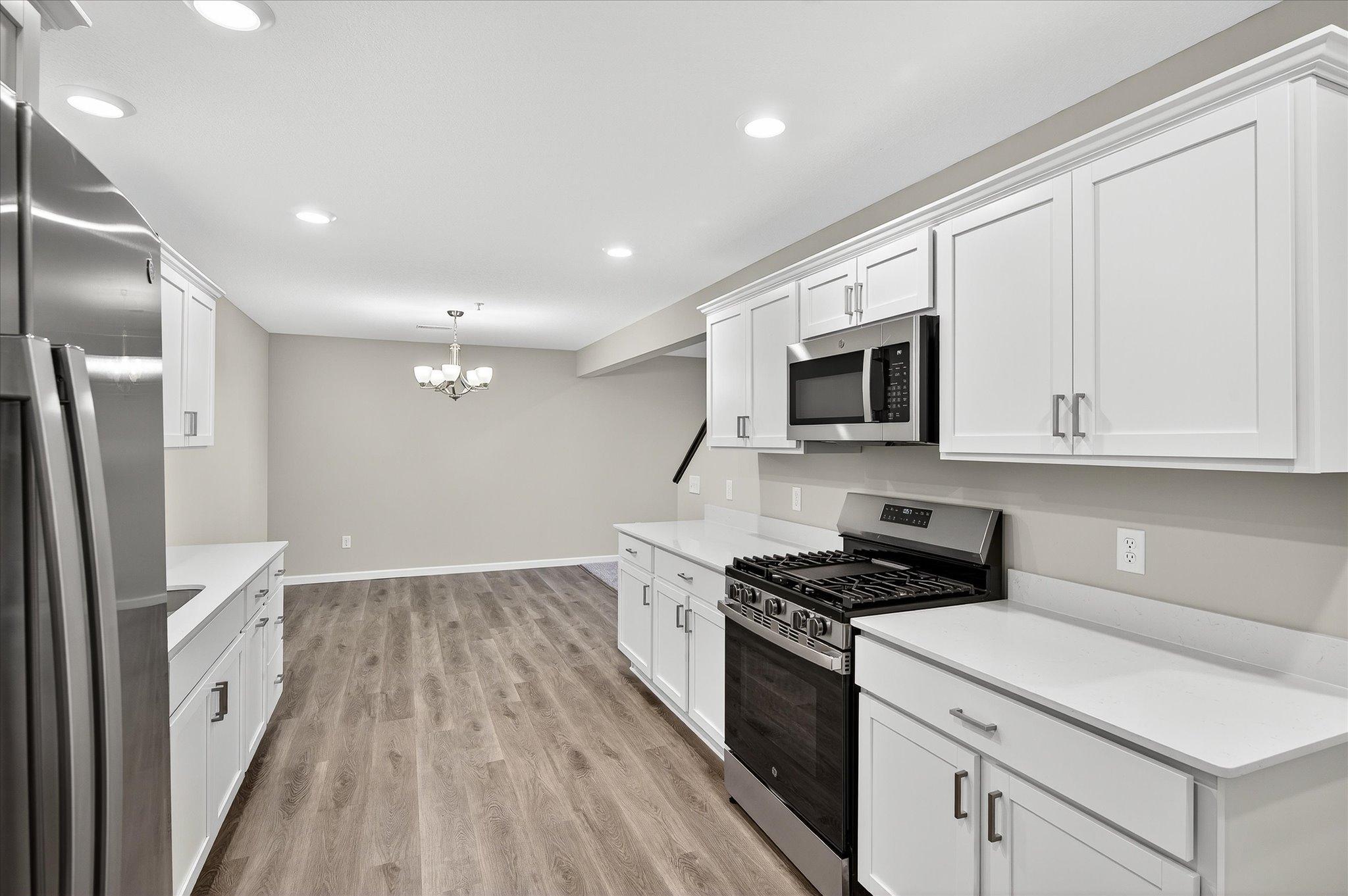 The kitchen flows directly into the dining and living spaces, so you'll never have to choose between hosting and being part of the conversation.