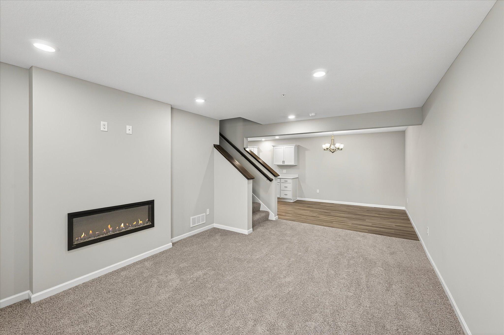 A cozy fireplace anchors the living room and creates the perfect spot for your sofa, favorite chairs, and evenings at home.