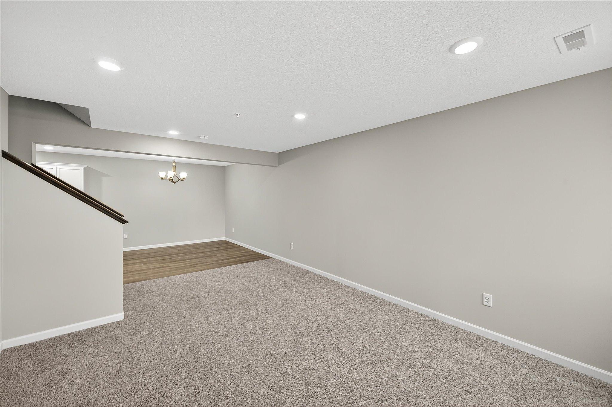 Open sightlines between the living room, dining area, and kitchen make the entire main level feel spacious and inviting.