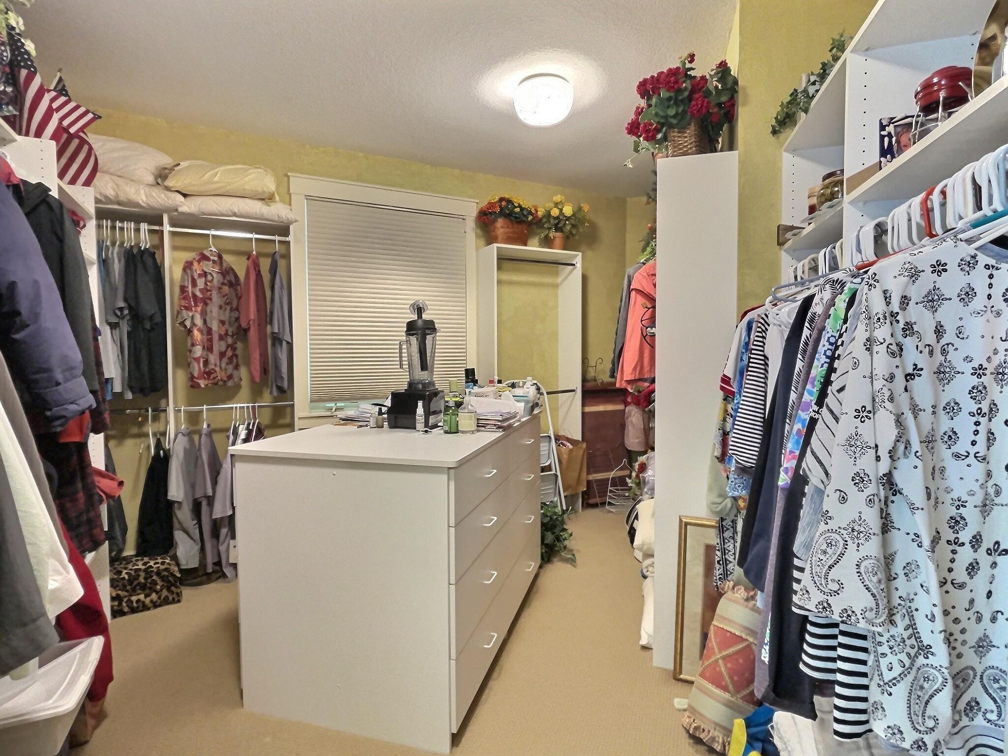 The primary suite walk-in closet is certainly spacious enough for all your clothes, shoes, blankets and so much more!