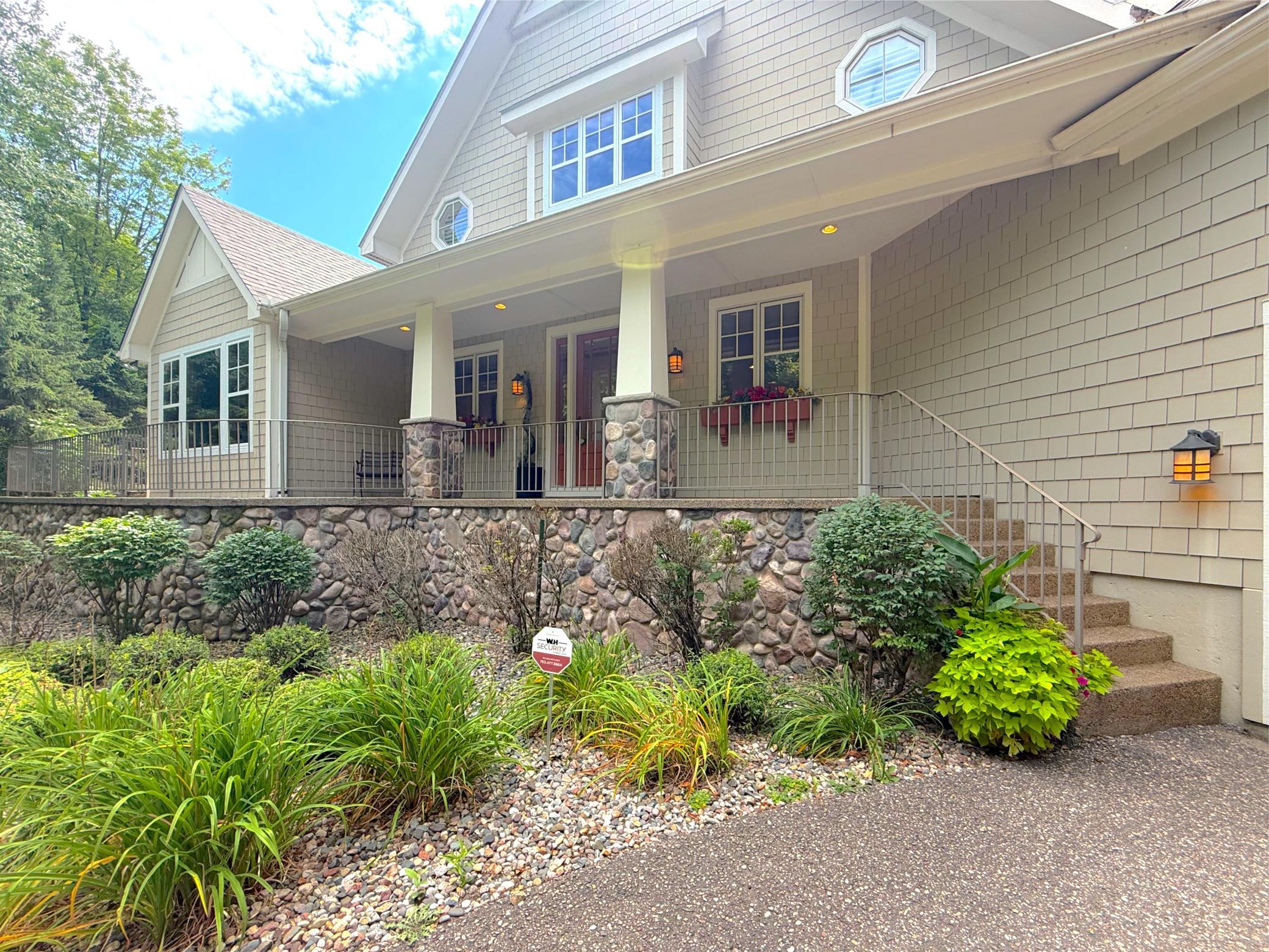 A covered porch welcomes you home to this gorgeous Lake Sylvia property surrounded with mature landscaping.