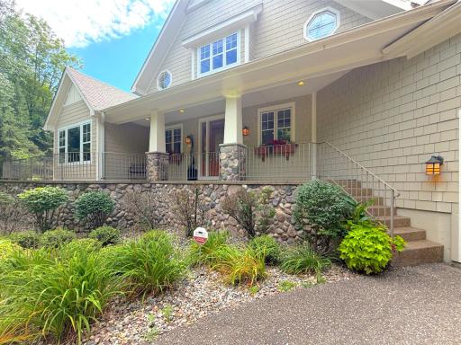 A covered porch welcomes you home to this gorgeous Lake Sylvia property surrounded with mature landscaping.