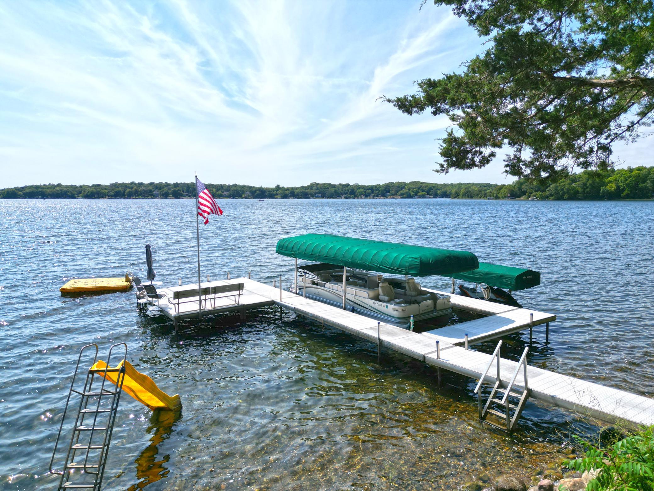 Fantastic tiered steps lead to the expansive beach offering hard bottom lakeshore.
