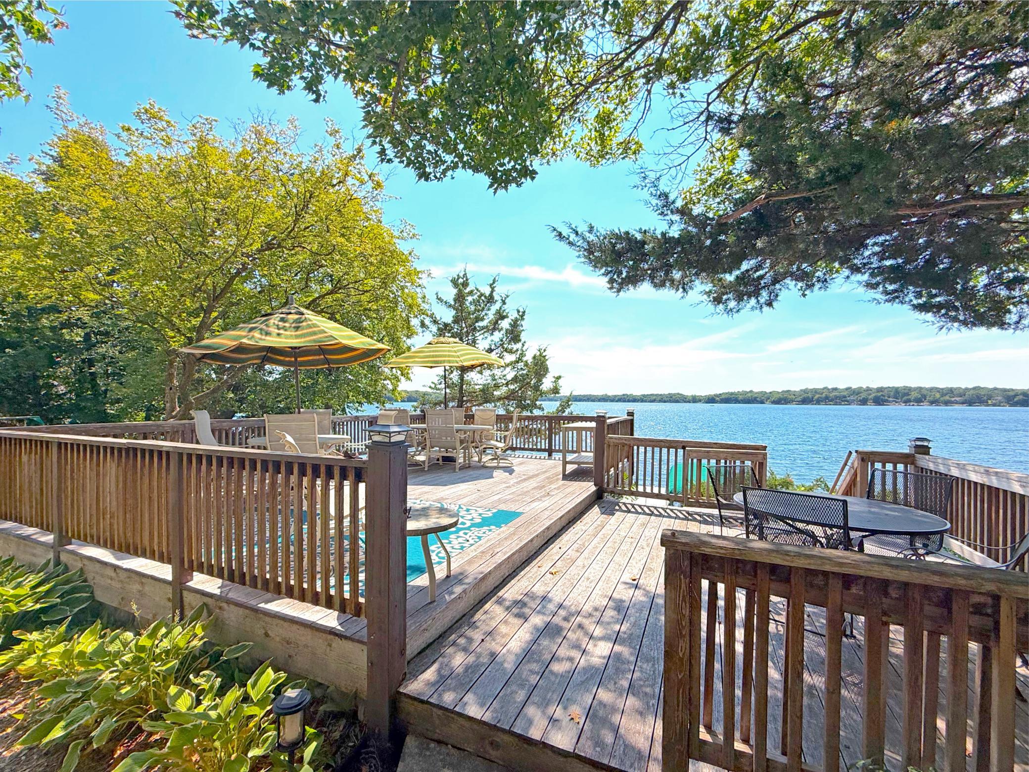An incredible view of Lake Sylvia's premier waters is framed by mature trees offering privacy. Overlook the beach from the 24x17 lakeside deck.
