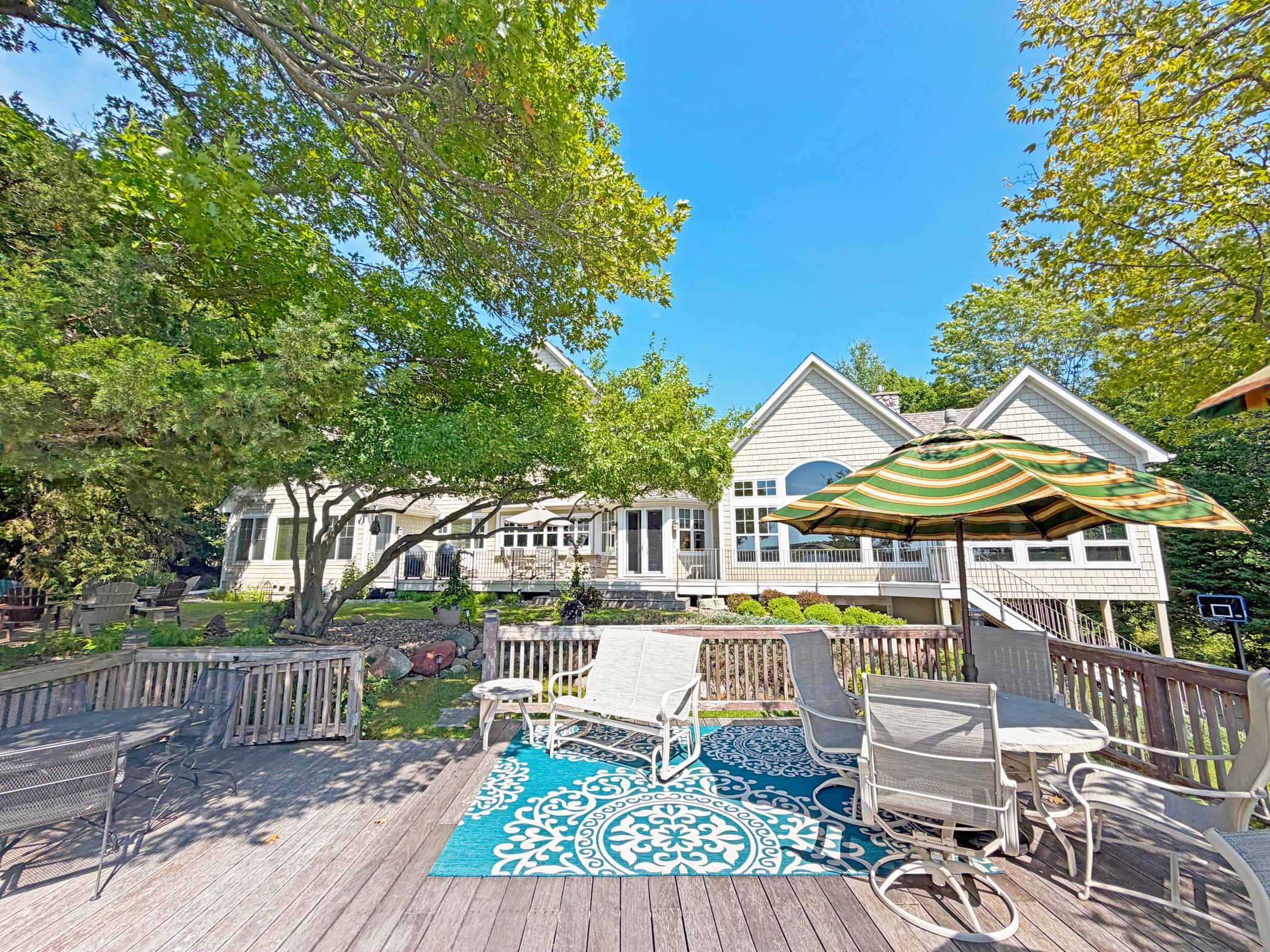 Retreat to luxury and relaxation in this expansive, 6,499 square foot vacation home tucked in the woods on the pristine waters of Lake Sylvia.