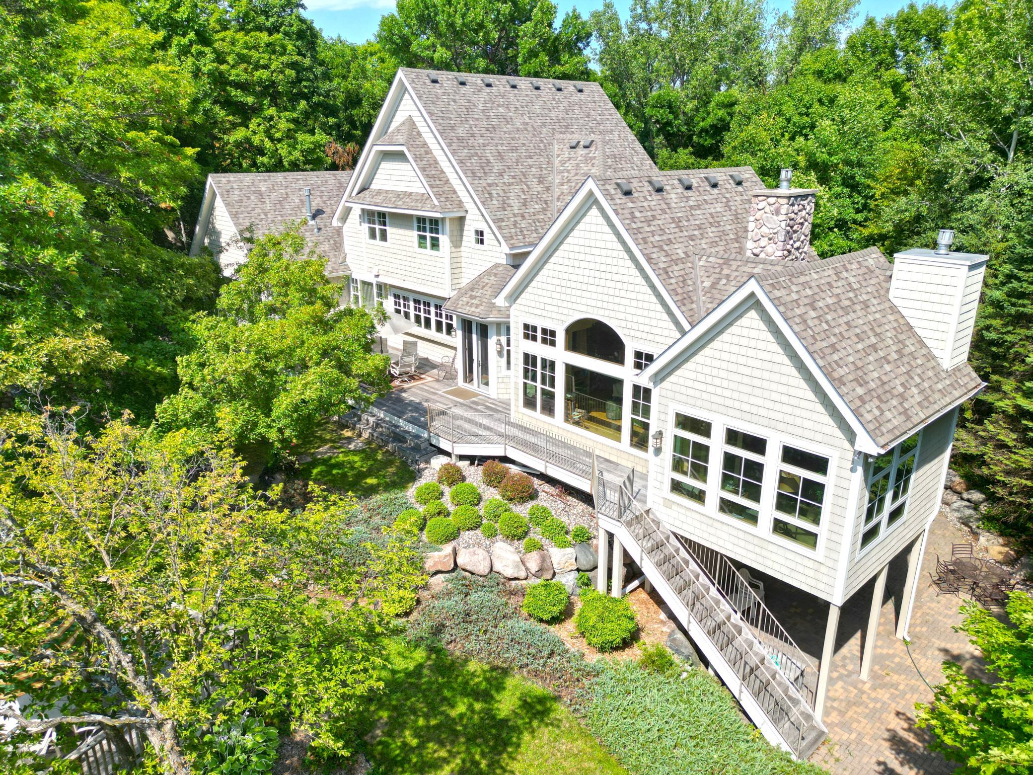 The lakeside of the home shows windows that offer stunning lake views from many rooms including all but one of the bedrooms.