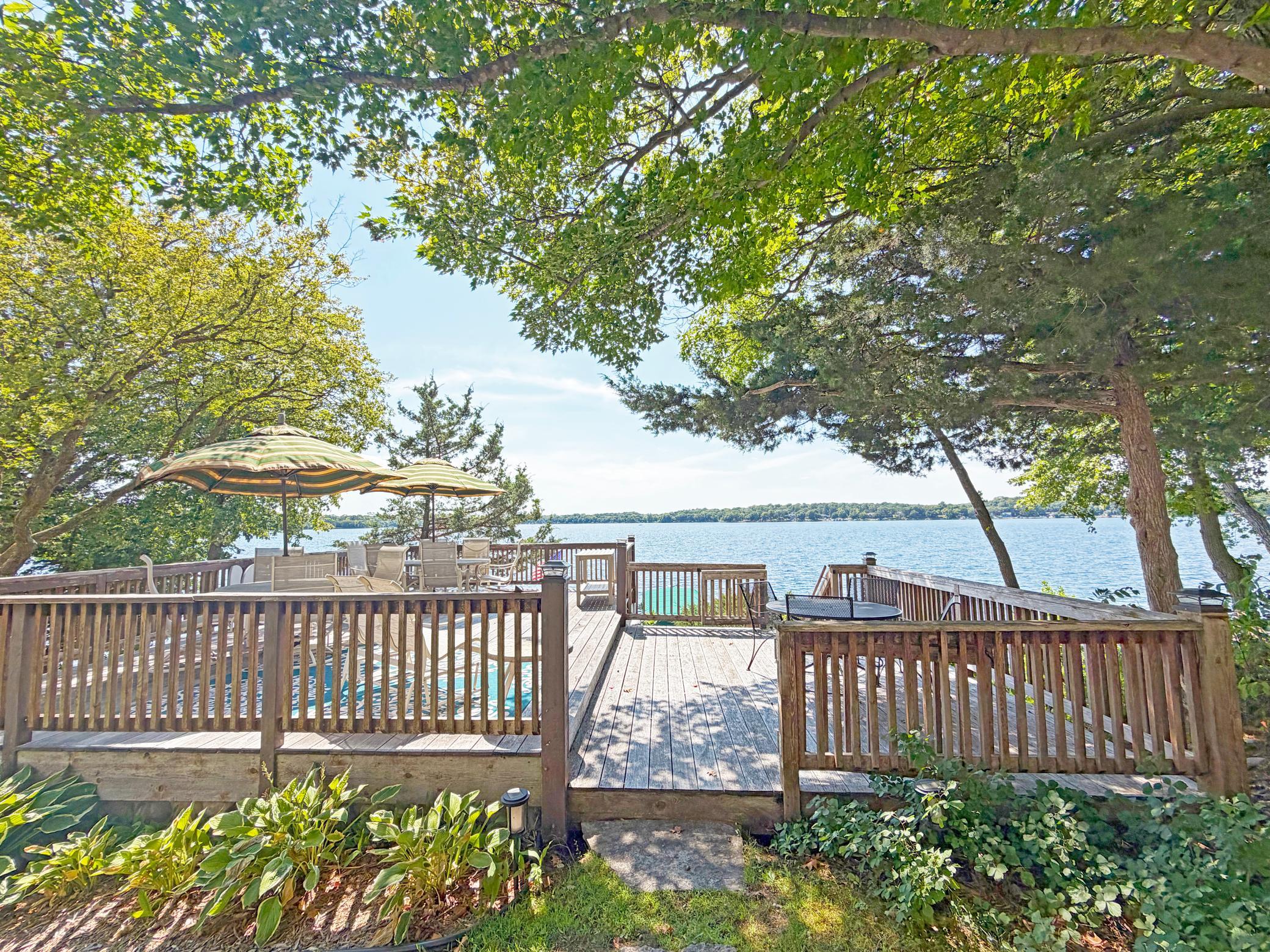 Enjoy the spacious lakeside deck on waters' edge that has a fantastic storage room below.