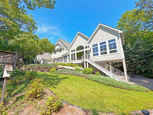 This expansive lake home is tucked in the woods on the pristine waters of Lake Sylvia