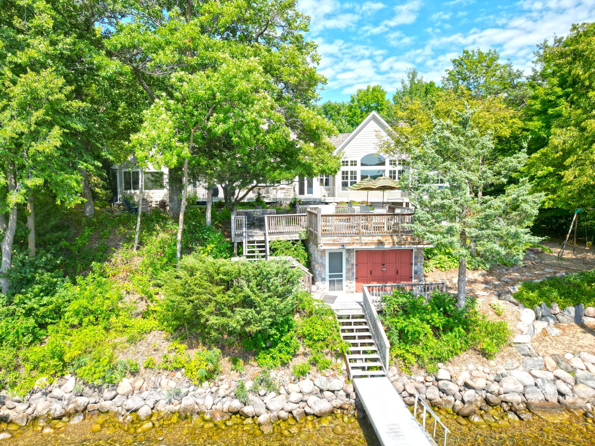 View of the property from the lake. Enjoy 150 feet of sand bottom shoreline. Lake Sylvia's water is crystal clear with over 17 feet of clarity.