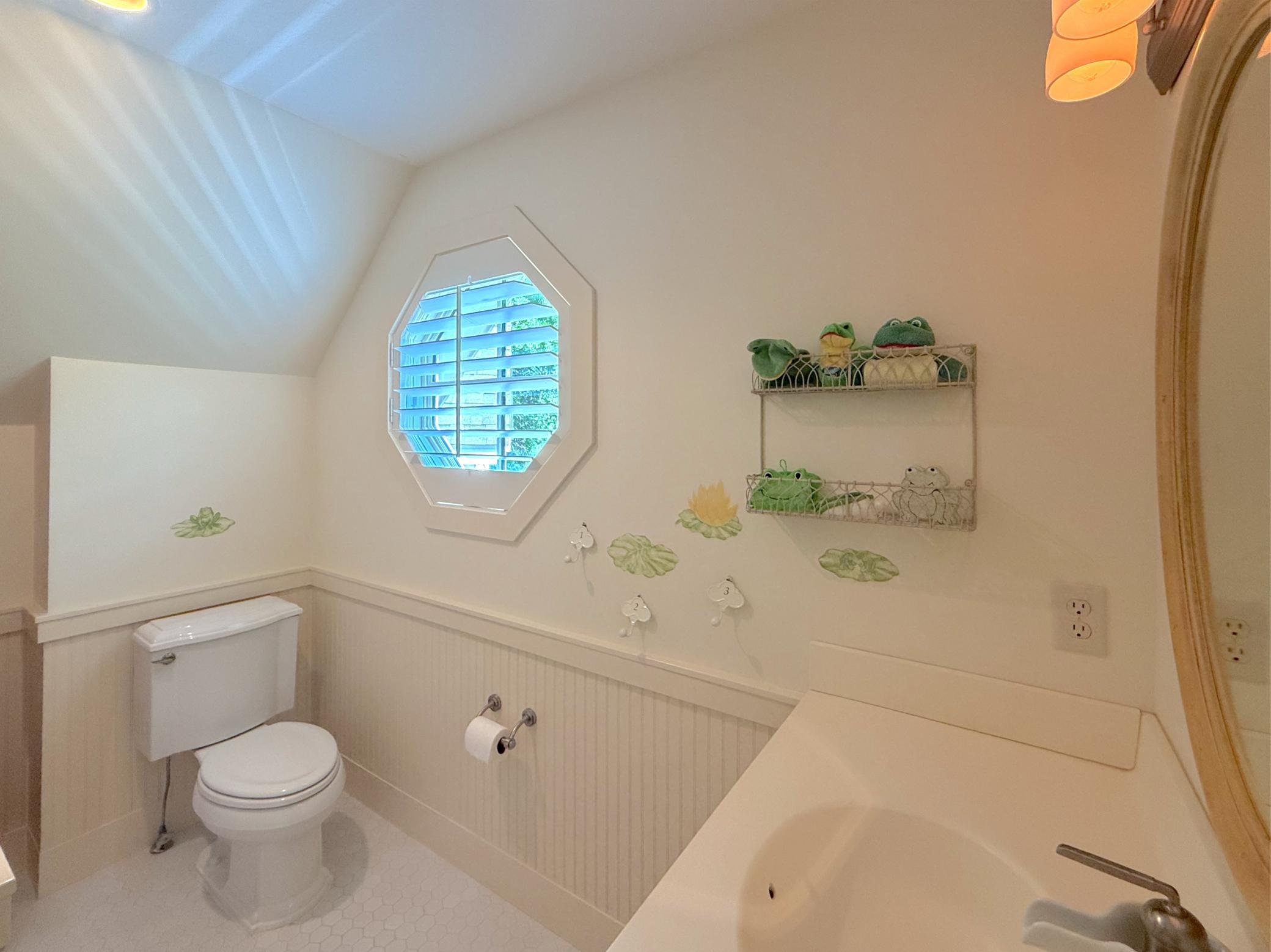 The three-quarter bathroom is just off the upper level bunk room ideal for the kiddos spending the weekend on the lake.