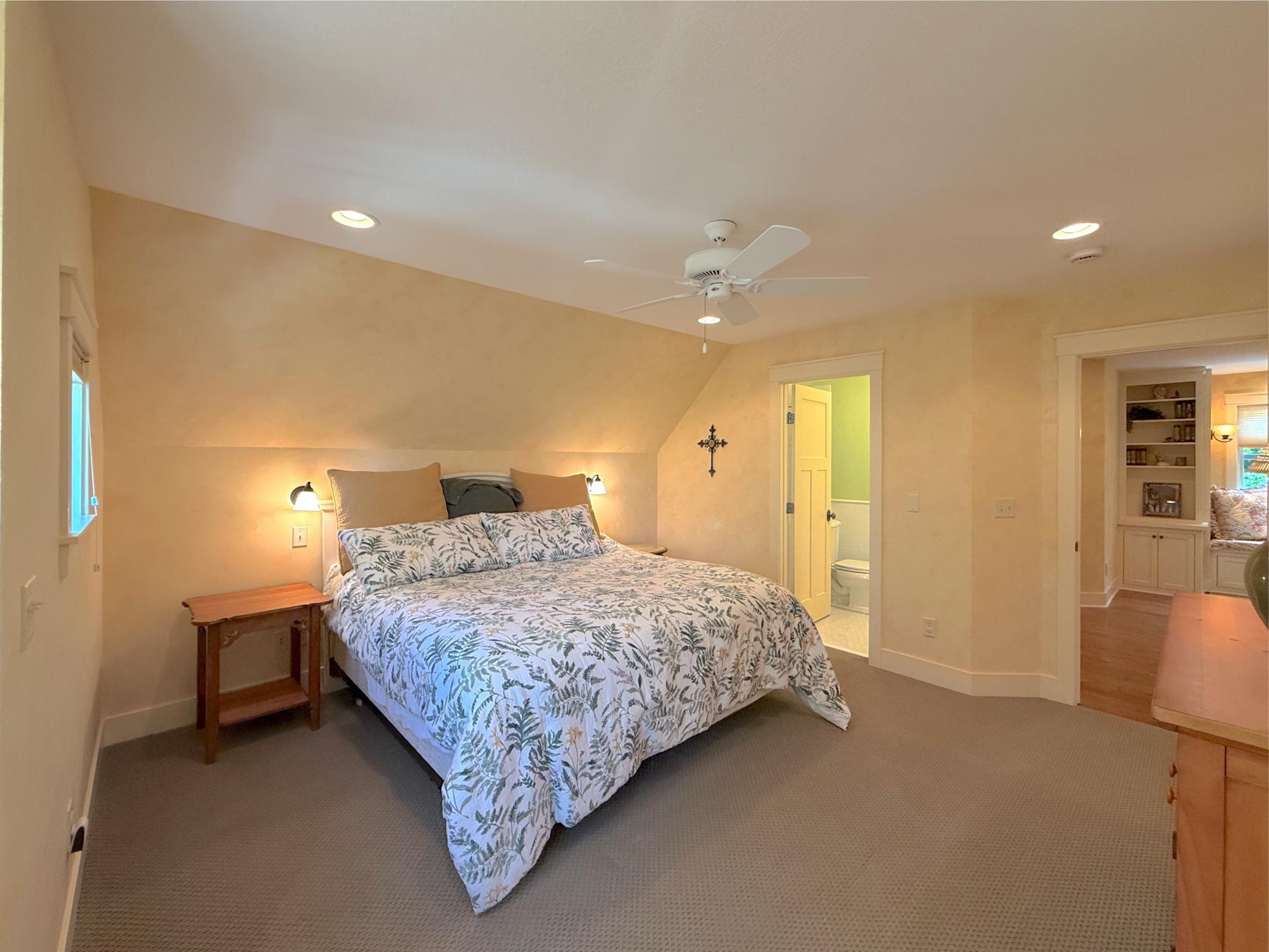 The second suite in the upper level is finished with a large closet, ceiling fan, plush carpet and private three-quarter bathroom.
