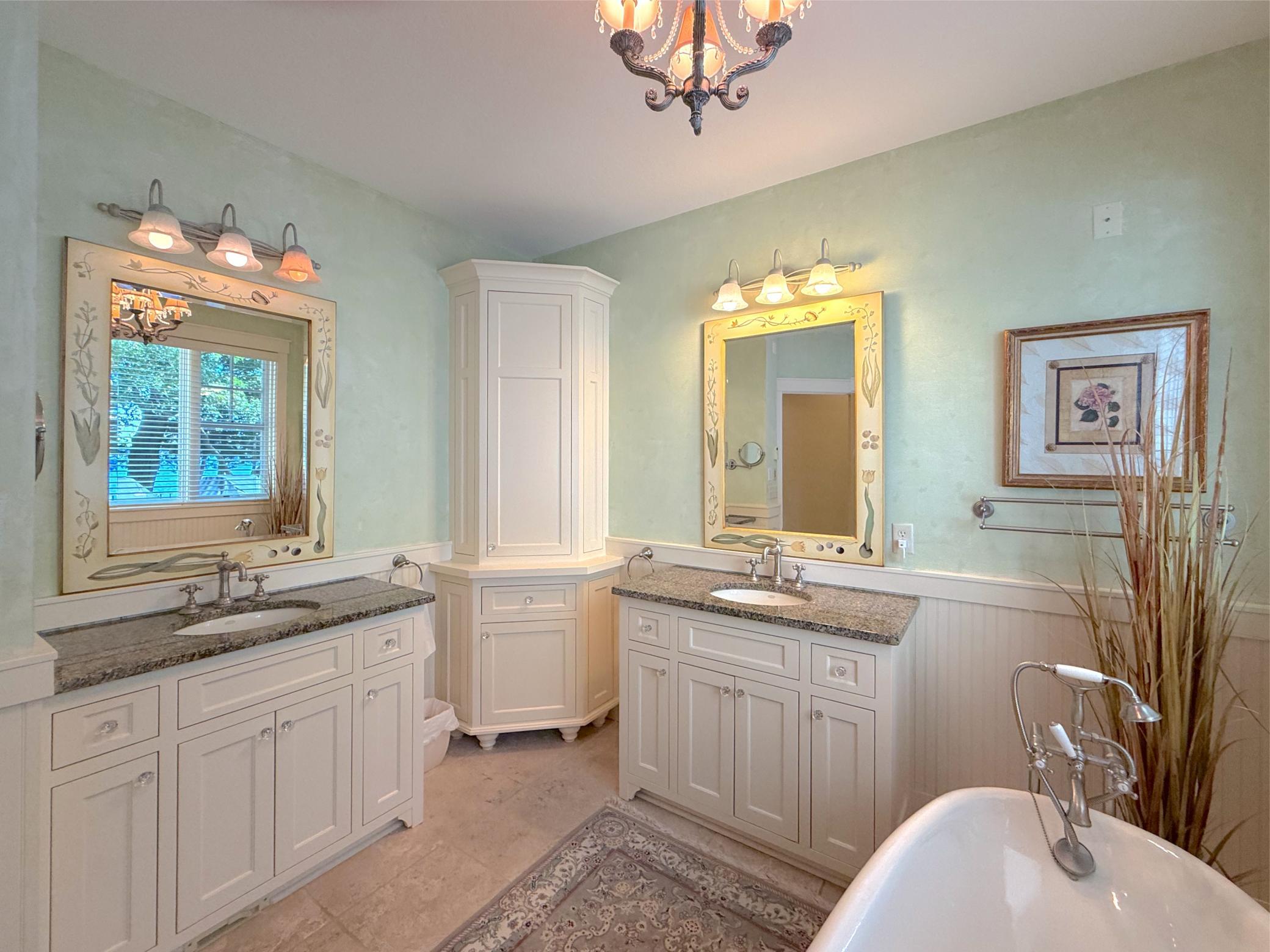 Relax in the gorgeous claw foot tub and enjoy plenty of storage space with double vanities including granite countertops.