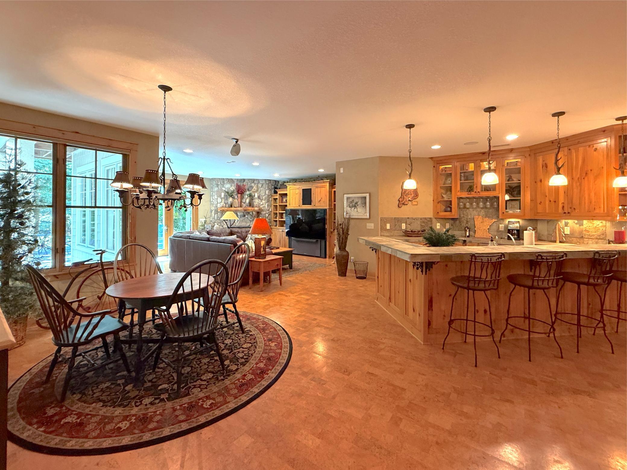 Gather around the table or bar, the lower level has wonderful seating space for an evening dining in or playing board games.