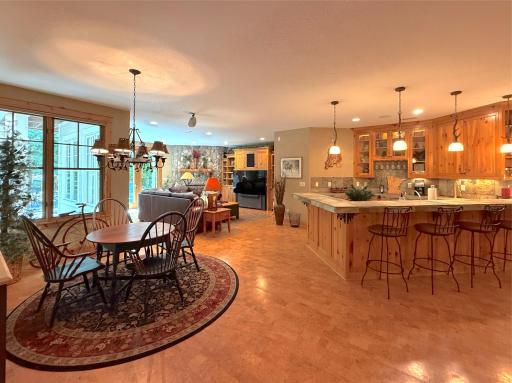 Gather around the table or bar, the lower level has wonderful seating space for an evening dining in or playing board games.