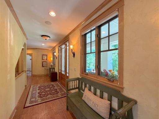 Enter into the home through a spacious foyer. Handscraped pine floors span across the main level living area.