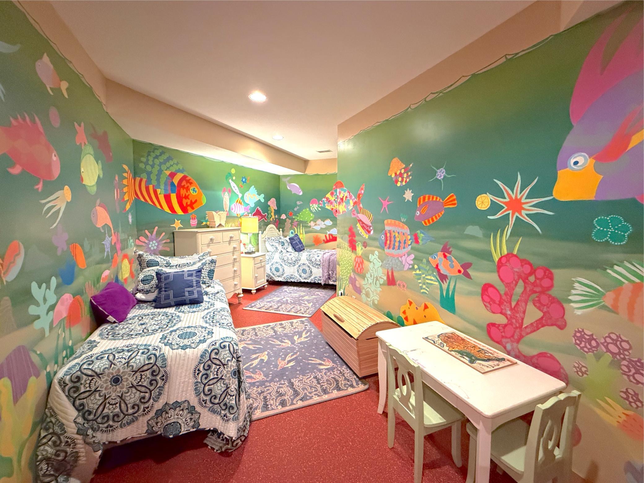 The kids will love this additional play room with vibrant hand-painted walls and tons of play space.