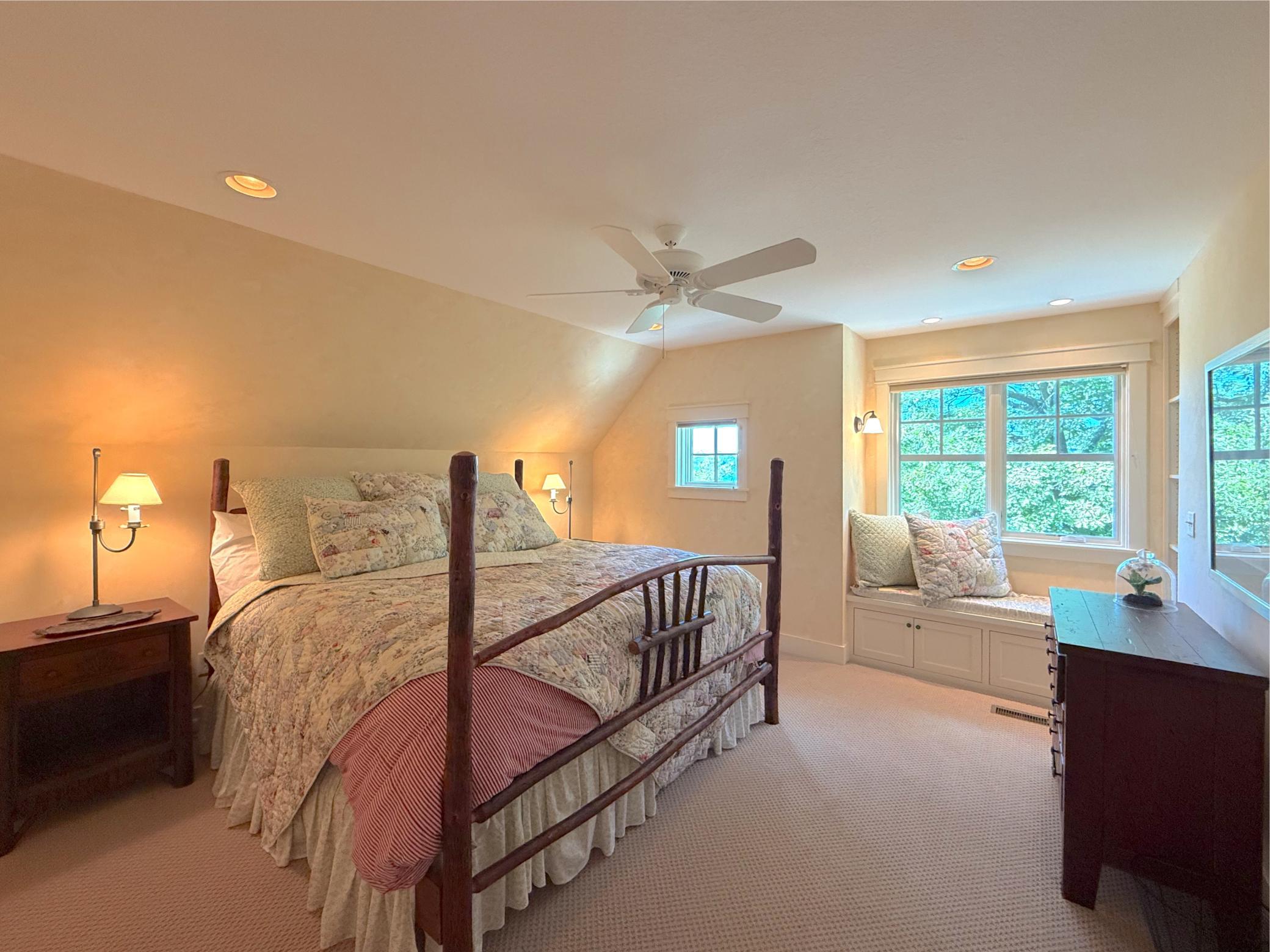 Escape for the night in one of the two upper level suites offering a comfortable window seat, large closet and lake views.