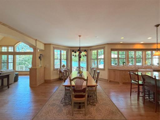 Gather around the spacious dining room that opens to the kitchen complete with a fantastic chandelier and wood floors.