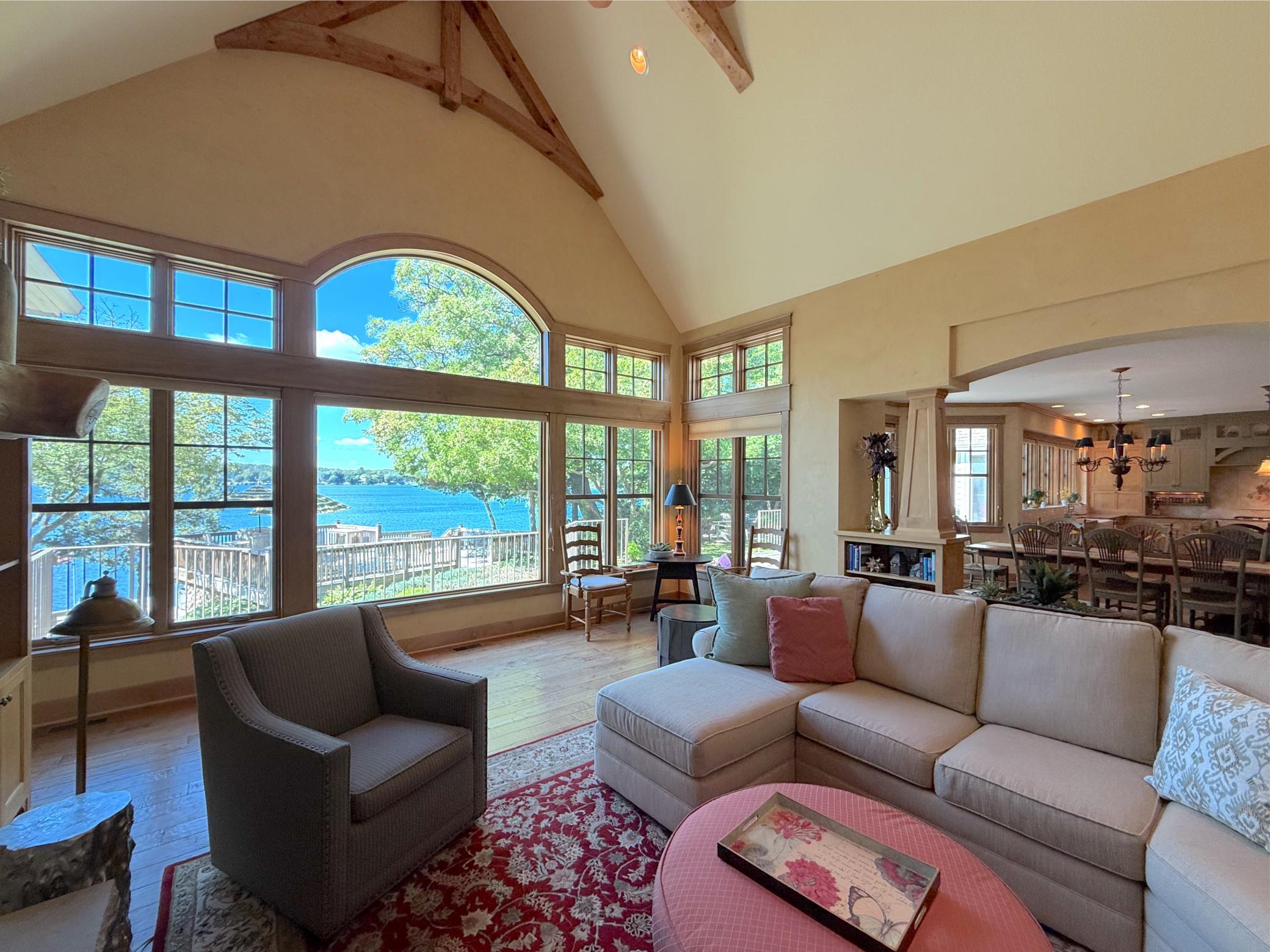 Gather in the vaulted main floor living room and revel in the spectacular panoramic lakeside views anytime of the year.