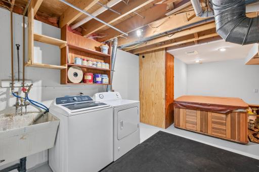 Lower level laundry. Sellers willing to remove hot tub (which is fully functional) if buyers wish.