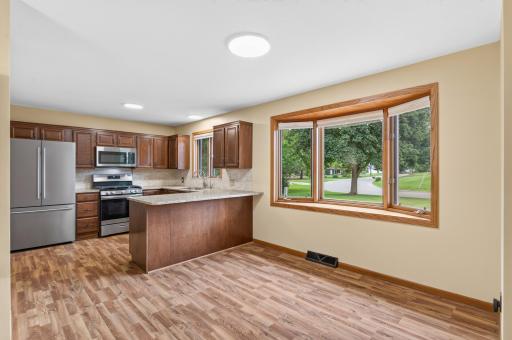 Dining room features bay window overlooking front of the home.