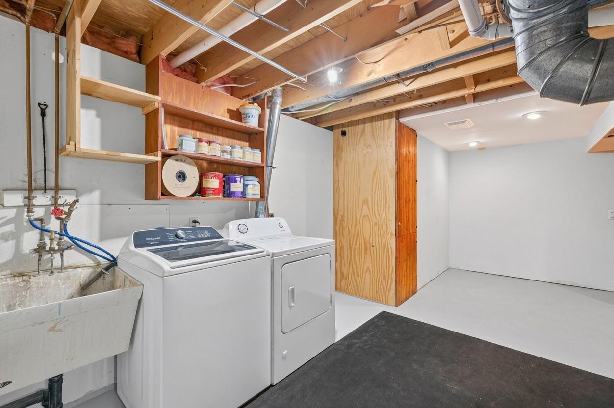 Lower level laundry room. Hot Tub used to be in the corner of this space, but as of 10/6, sellers are working to remove it fully from the property.