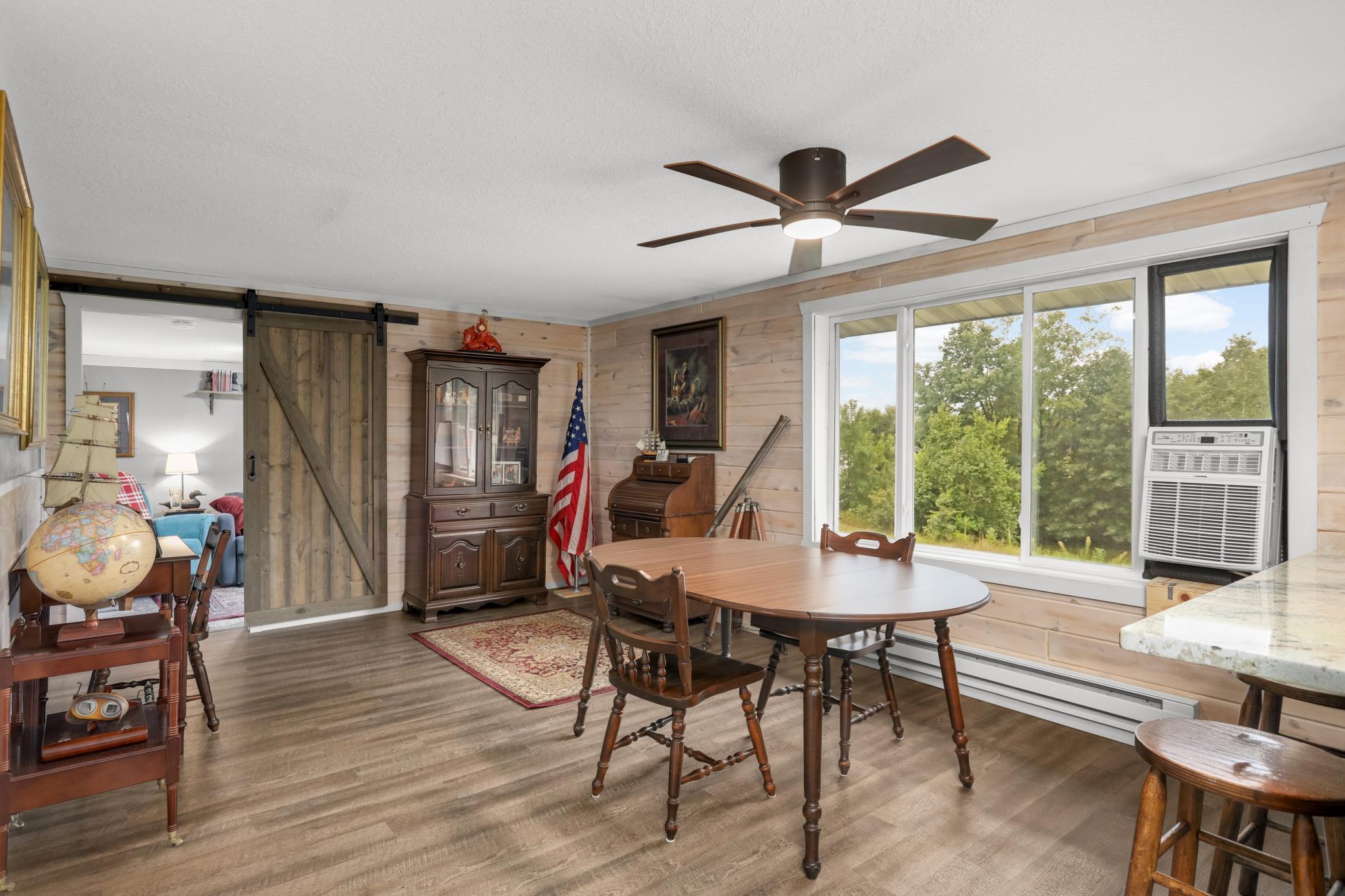 Versatile dining room area that can also be divided and used as another sitting room/living room.