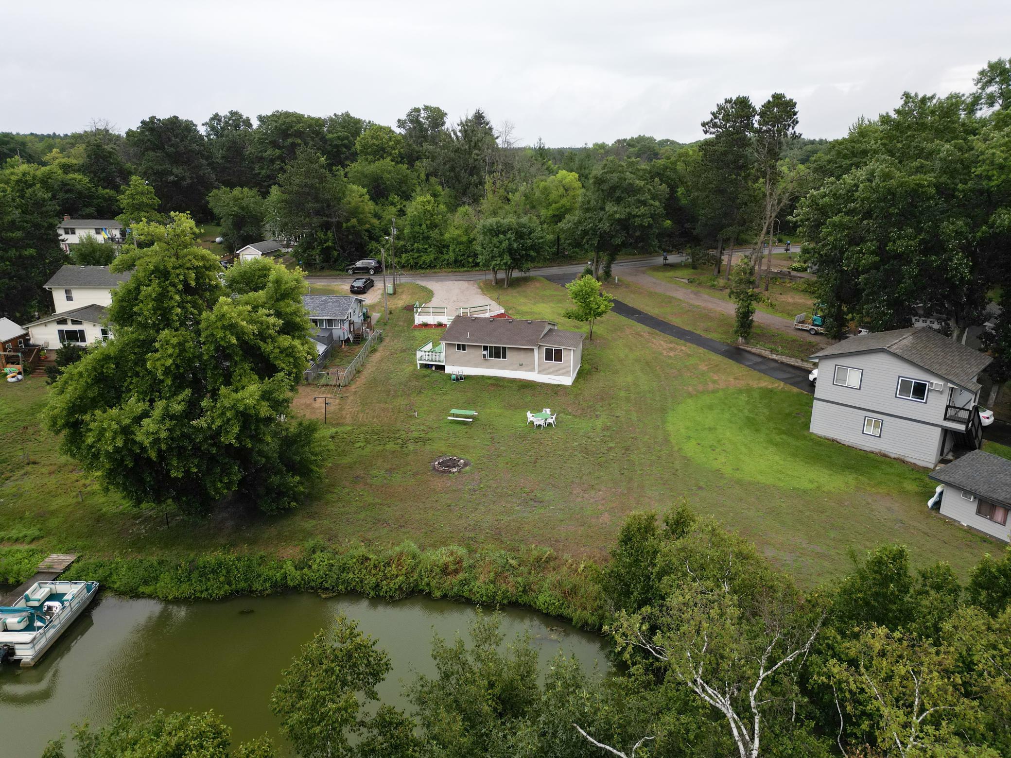Nature views from all directions in this cute, lakefront home.