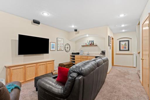 Ideal space for movie night or entertaining with a convenient wet bar.