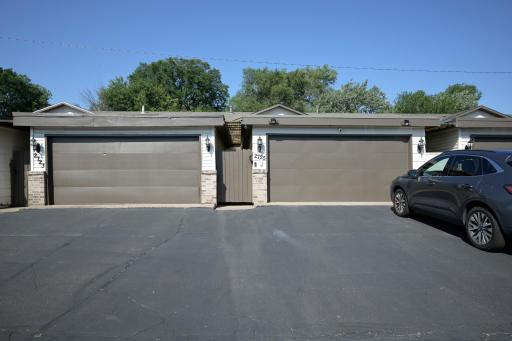 New garage door and opener. Gate leads to the covered porch